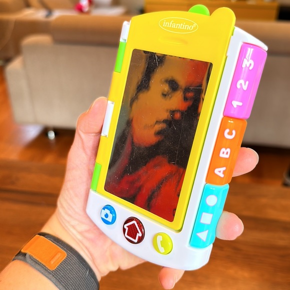 Multi-pack take along toys. Includes remote, phone and misc. book type toy. - Picture 3 of 11